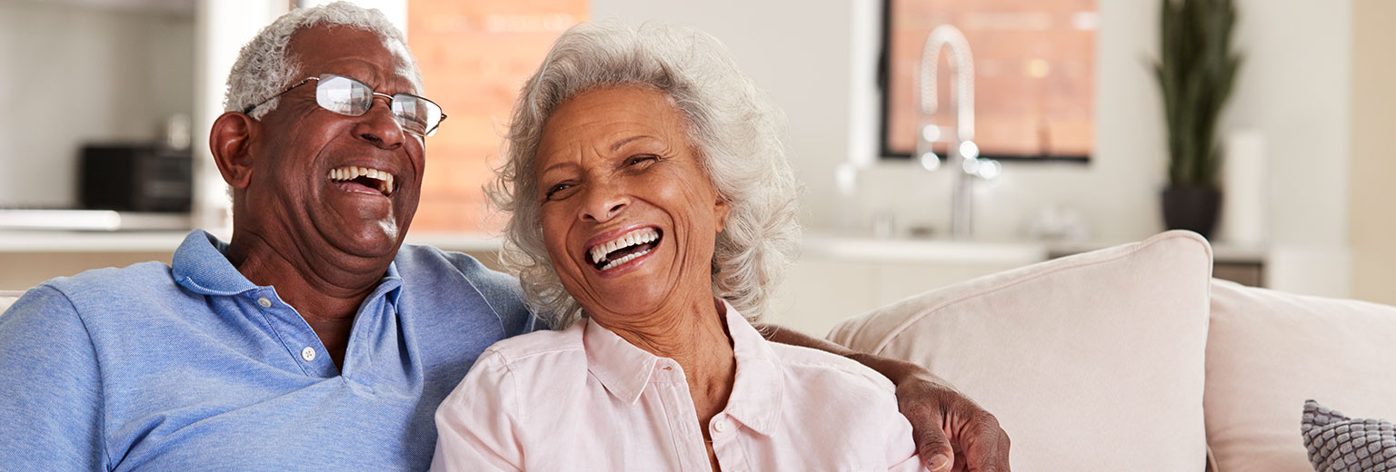 Senior couple is smiling after Dental Implants