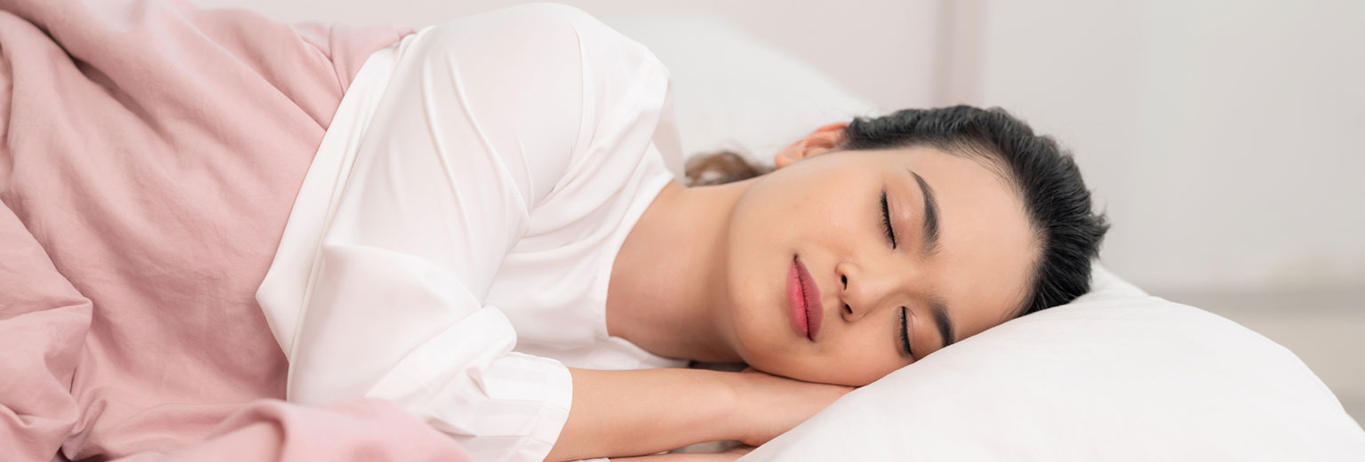 Woman sleeping after sleep apnea treatment